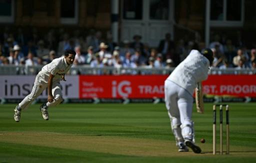 England's Josh Tongue (R) drives at a ball bowled by Pakistan's Mohammad Abbas in the second Test at Lord's — Glyn KIRK / AFP