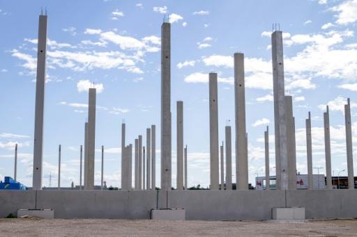 Grey columns already rise from the ground for a planned business park on the former concentration camp's site — Jure CUFER / AFP