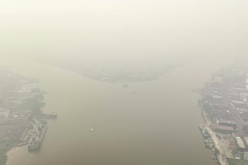 Indonesia escalates battle against fires, putrid haze