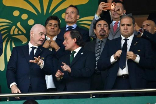 FIFA President Gianni Infantino's likeliest challenger is CONCACAF President Victor Montagliani (R) — CARL DE SOUZA / AFP