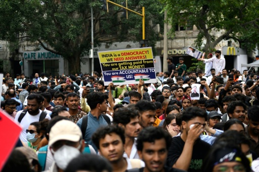 Indian police fire tear gas, baton charge exam protesters