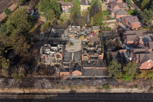 Three firefighters were hospitalised fighting that blaze southwest of Birmingham — Darren Staples / AFP