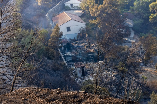 The fires destroyed buildings and sent residents fleeing to shelters — MIROSLAV LELAS / AFP