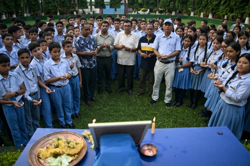 Mourners and students paid their respects to mountaineer Nirmal Purja, gathering around a framed photograph of the climber — Prakash MATHEMA / AFP