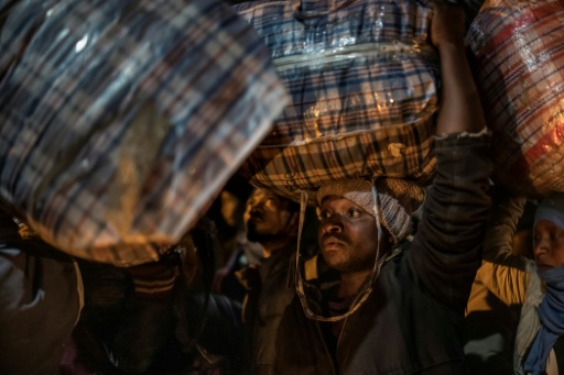 More than 160,000 migrants left in a matter of weeks, most of them Malawians and Zimbabweans — MARCO LONGARI / AFP