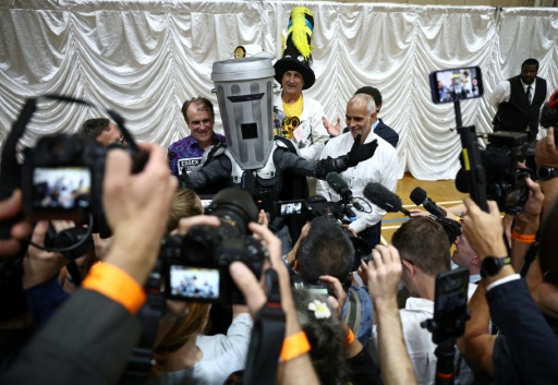 Nigel Farage did not attend the announcement of the results in Clacton though other candidates, including Count Binface (C), did — Henry NICHOLLS / AFP