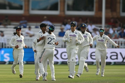 India's players celebrate as England's Tammy Beaumont is lbw to Kranti Gaud in the inaugural women's Test at Lord's