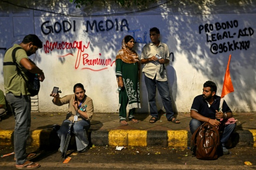 The term "godi" -- "lap" in Hindi -- is used by critics to refer to so-called "lapdog" media accused of abandoning their watchdog role — Arun SANKAR / AFP