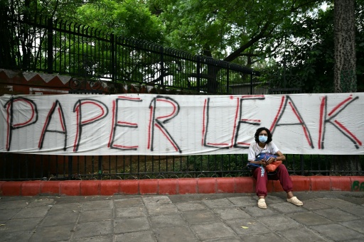 A Cockroach Janta Party (CJP) supporter sits at Jantar Mantar in New Delhi on July 23, 2026 during the ongoing protest to demand the resignation of India's Education Minister Dharmendra Pradhan — Sajjad HUSSAIN / AFP
