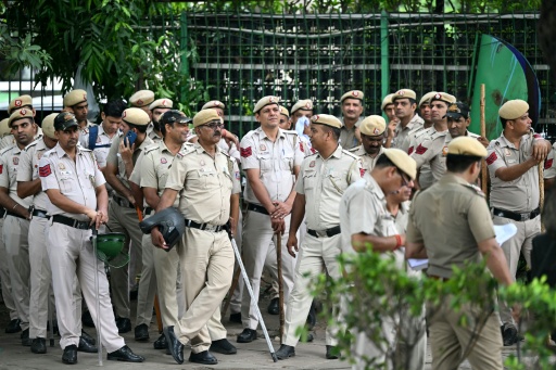 Police personnel stand guard at Parliament Street in New Delhi  during the ongoing protest to demand the resignation of India's Education Minister Dharmendra Pradhan over alleged NEET exam irregularities — Sajjad HUSSAIN / AFP