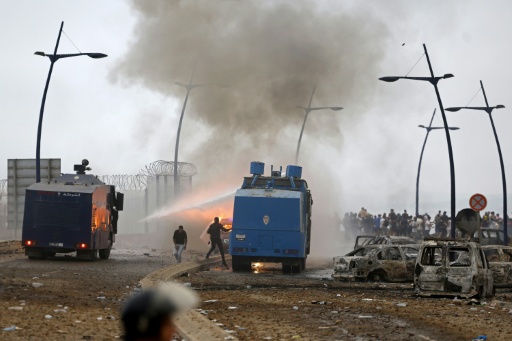 Moroccan security forces use water canon to disperse the crowds at the site of clashes near Fnideq on the Morocco-Spain border — Abdel Majid BZIOUAT / AFP
