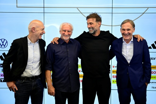 The vice-president of the German Football Association (DFB), Hans-Joachim Watzke (R), says FIFA's plans are an attack on football — John MACDOUGALL / AFP