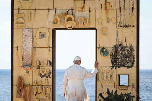 Pope Leo XIV prayed after laying a wreath of flowers on the unmarked graves of shipwreck victims at a cemetery on Lampedusa island