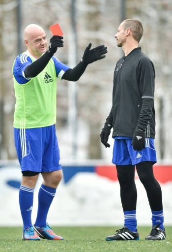 UEFA president Aleksander Ceferin (R) appears keen to show his FIFA counterpart Gianni Infantino (L) a red card — Michael Buholzer / AFP