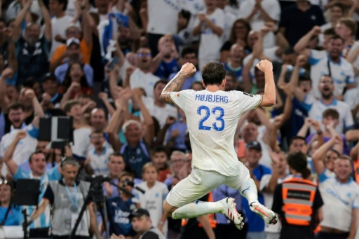 La joie de Pierre-Emile Hojbjerg, buteur lors du match d'ouverture de la 1re journée de Ligue 1 entre l'Olympique de Marseille et Strasbourg au stade Vélodrome le 21 août 2026 — Pascal POCHARD-CASABIANCA / AFP
