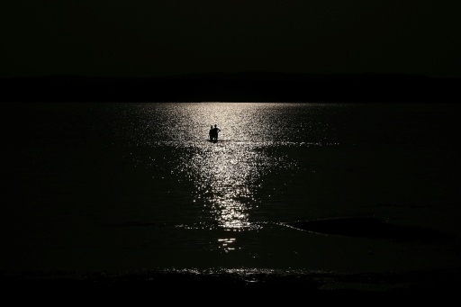 Many tourists have chosen to stay away as a result of the lake's low ebb — Attila KISBENEDEK / AFP