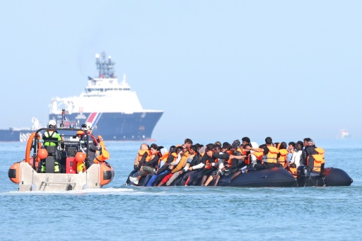Migrants aboard a smugglers' boat attempt to cross the English Channel off the beach of Gravelines, northern France, on July 29, 2026 — Francois LO PRESTI / AFP