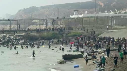 Hundreds of migrants flood into Spain's Ceuta exclave from Morocco