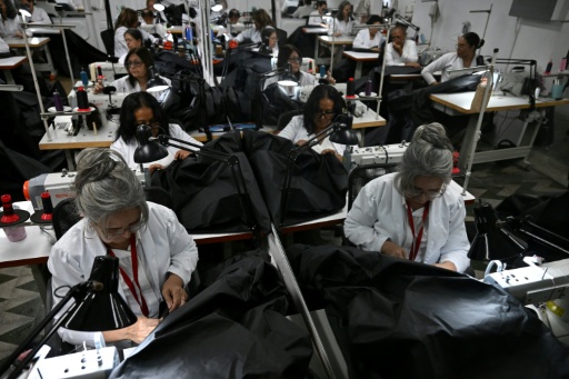 Venezuelan fashion house stitches body bags for quake victims