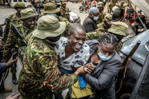 Kenyan police swarmed on a tiny group trying to protest
