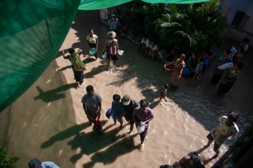 Residents in the township of Wetlet have been forced to flee the floodwaters — - / AFP