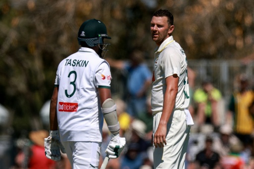 Bangladesh’s Taskin Ahmed (L) reacts after running into Australia’s Josh Hazlewood (R) in the second Test at Mackay — DAVID GRAY / AFP