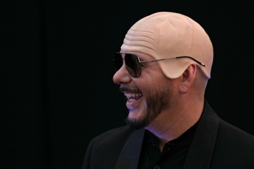US rapper Pitbull sets bald cap world record at London show