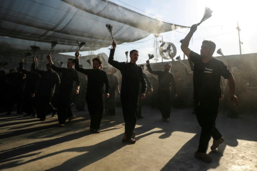 Shia Muslim pilgrims performed the Latmiya chest-beating ritual in the Bayn al-Haramayn or "between the two sanctuaries", a marble-paved avenue linking the Imam Hussein Shrine and the Imam al-Abbas Shrine — Karar Jabbar / AFP