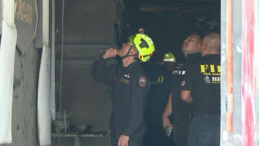 Forensic police inspect aftermath of deadly Bangkok bar fire