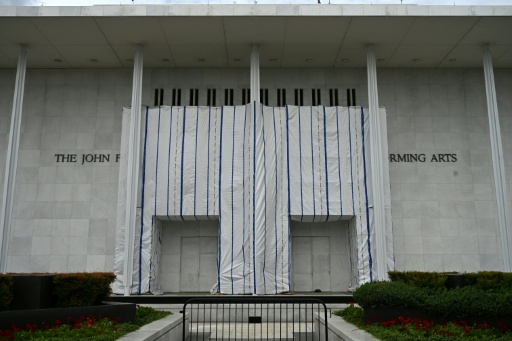 A tarpaulin covers the facade of the Kennedy Center where President Donald Trump's name was removed