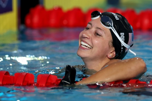 American Kate Douglass celebrates after winning the 50m freestyle final at the Pan Pacific Championships in her second world record of the day — Maddie Meyer