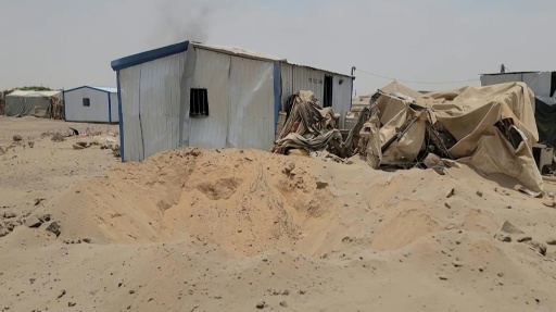 Footage the damage at Mail al-Saila internally displaced camp on the outskirts of Marib following a reported Houthi ballistic missile attack on the government-held city — - / AFP