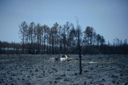 French PM announces help for fire-hit regions after jeers from locals