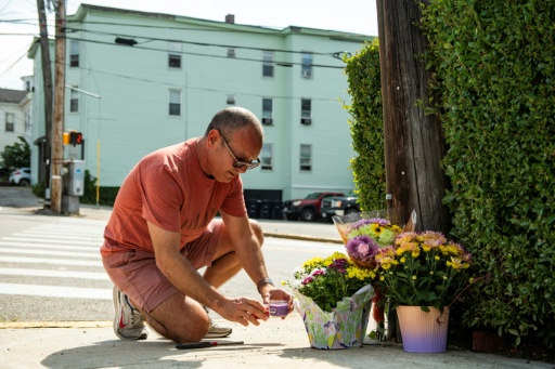 A makeshift memorial formed at the scene where a federal immigration officer shot and killed a person earlier in the day in Biddeford, Maine