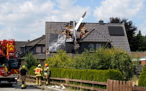 Two dead after plane crashes onto German house's roof