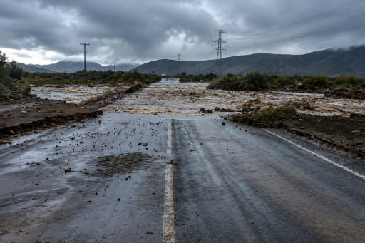 A road cut off by rising river waters in La Serena, Chile following heavy rainfall — Handout / AFP