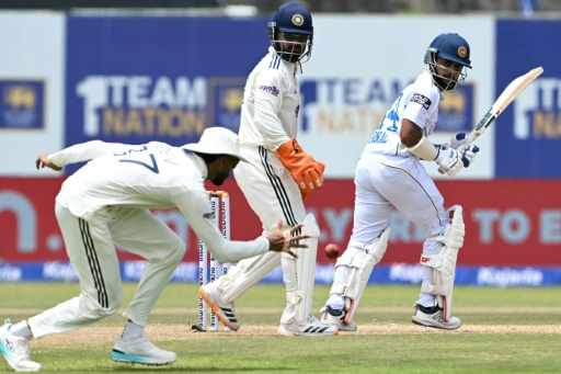 Rain halts India push after Dinusha century lifts Sri Lanka