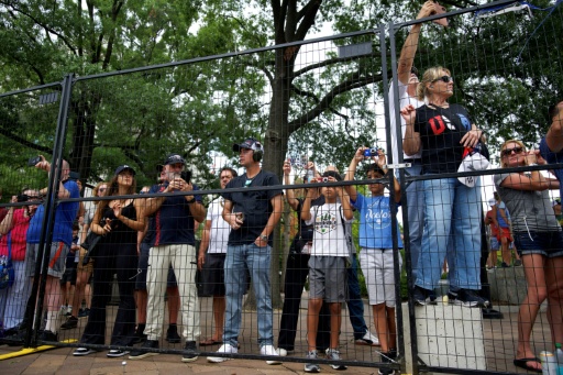 Spectators line the track to watch IndyCars during a practice session for the Freedom 250 Grand Prix in Washington — Kent Nishimura / AFP