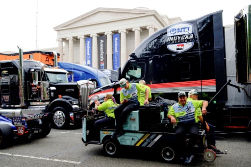 Race team staff prepare to load vehicles into the pit lane area in front of the National Gallery of Art for the Freedom 250 Grand Prix auto race in Washington — Kent Nishimura / AFP