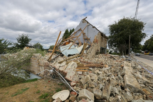 A 'mini-tornado' struck a town outside Belgium's High Fens park, as firefighters battled to bring a massive wildfire under control — JULIEN WARNAND / AFP
