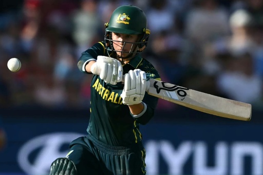 Australia's Phoebe Litchfield hits a boundary during the Women's T20 World Cup final against England at Lord's