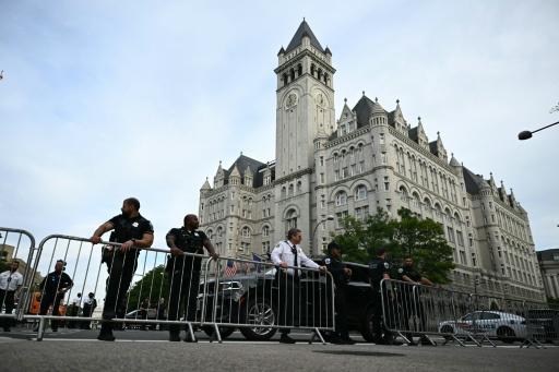 Police officers secure the outside of the 2026 White House Correspondents' Dinner at the Waldorf Astoria featuring President Donald Trump as the key guest — Kent NISHIMURA / AFP