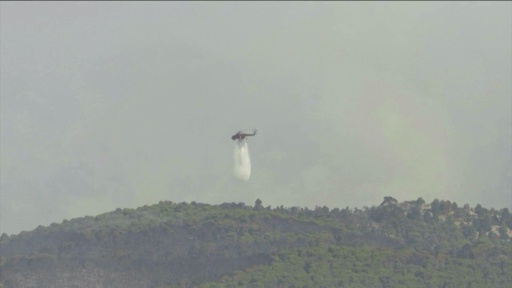 Water-bombing helicopters battle Greece wildfires