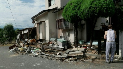 Residents survey damaged homes in Japan's Kumamoto after major quake — Fred Mery / AFP