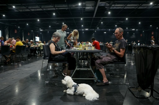 Thousands of people are being put up in emergency shelters — ALAIN JOCARD / AFP