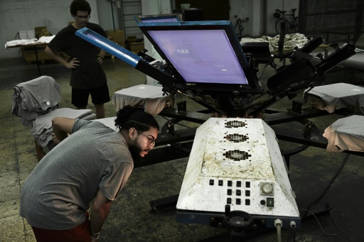 Men work at the private screen-printing business La Cabra Studio in Havana on June 22, 2026