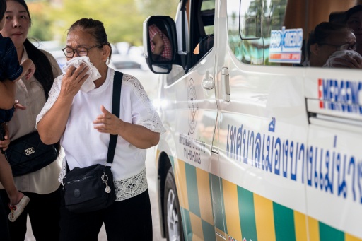A woman at Bang Yai hospital in Nonthaburi province reacts to the news — Chanakarn LAOSARAKHAM / AFP