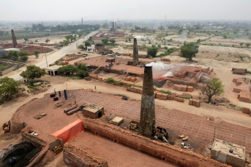 An aerial view shows a brick kiln in Sheikhupura, in Pakistan's Punjab province on July 20, 2026. Pakistan is ranked among the countries most vulnerable to the impacts of climate change globally, according to experts. — Arif ALI / AFP