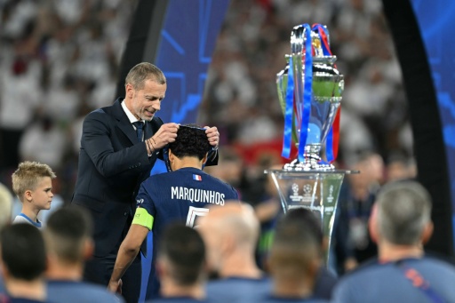 UEFA President Aleksander Ceferin (L) emerged with credit from the FIFA plan fiasco — NICOLAS TUCAT / AFP