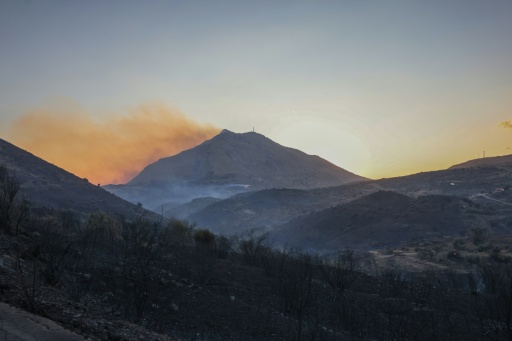 Thousands of people were evacuated late on Wednesday as fires threatened a tourist resort on the Greek island of Crete — Costas Metaxakis / AFP